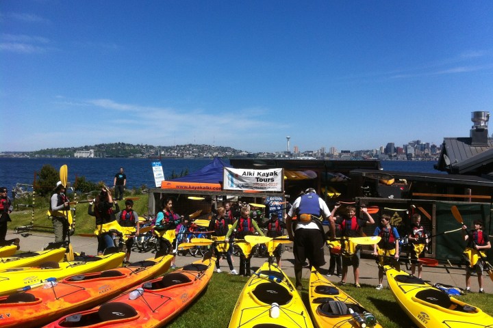 a group of people riding on the back of a boat