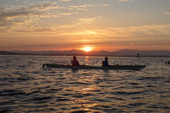 a sunset over a body of water
