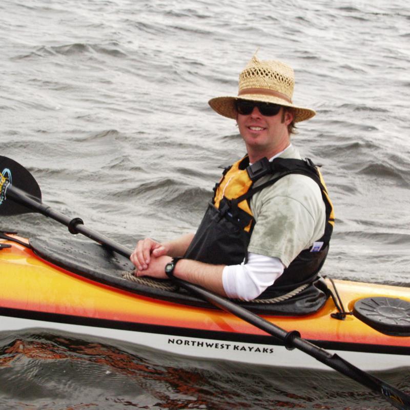 Man smiling in a kayak